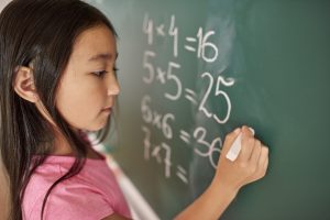focus girl trying solve mathematical equation scaled